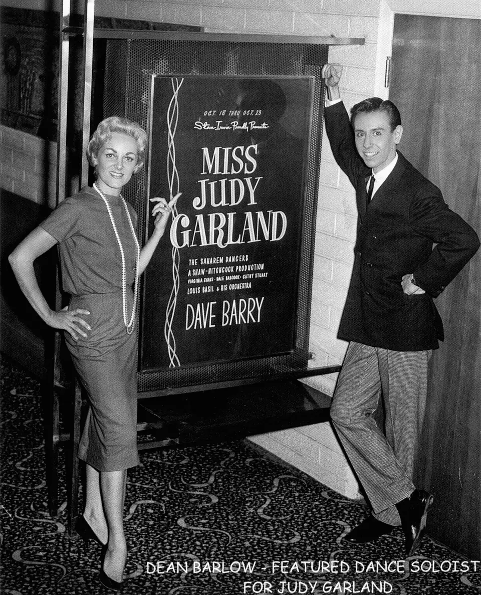 Dean beside a poster billing Judy Garland