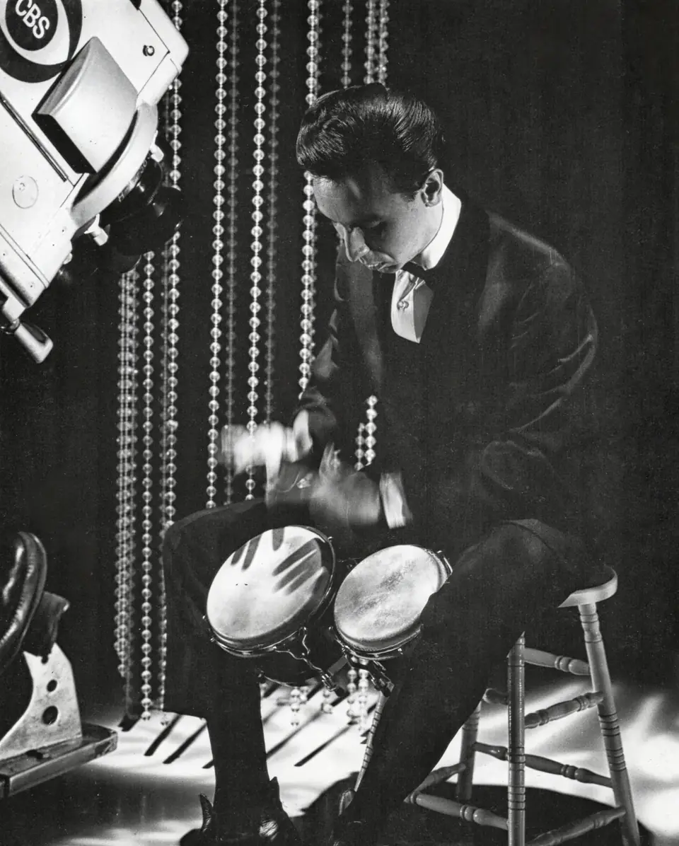 Dean with bongos, CBS headshot, 1960