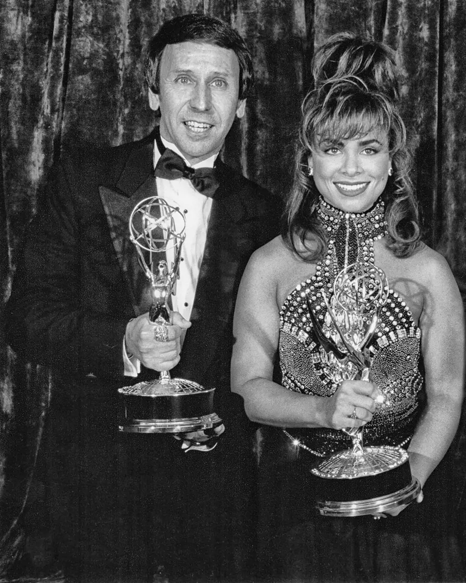 Dean holding an award statuette
