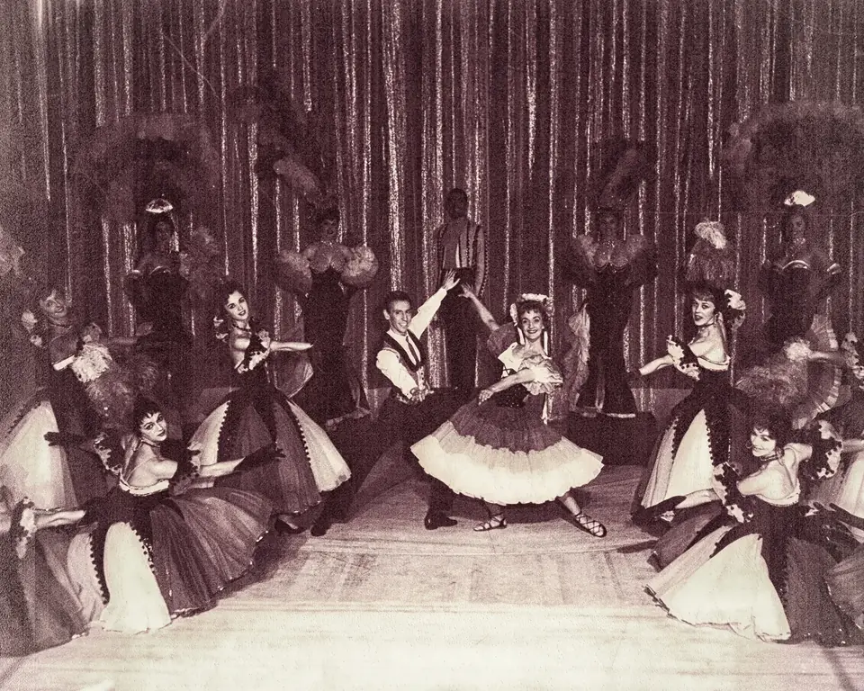 A full cast of dancers on stage